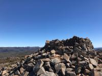 A pile of rocks with a blue sky