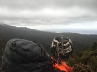 Precipitous Bluff in the background, with a river and beach in the foreground